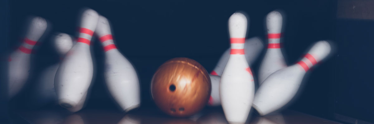 Bowling Pins Being Knocked Down
